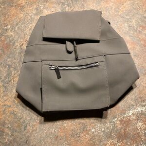 Amanda Smith, gray canvas small backpack with black straps adjustable